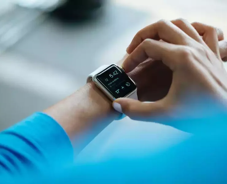 Man operating Apple Watch on his wrist